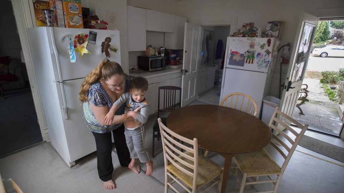 Andrea Clancy and her son Dylan, in the downstairs kitchen at the Oxford House, a Homes First project on Olympia Street, Feb. 26, 2015. Homes First’s Opening Doors event explains how local nonprofit puts people in affordable rental homes.12:15 – 1:15 p.m. April 11, To RSVP and receive the address call 360-915-8176.