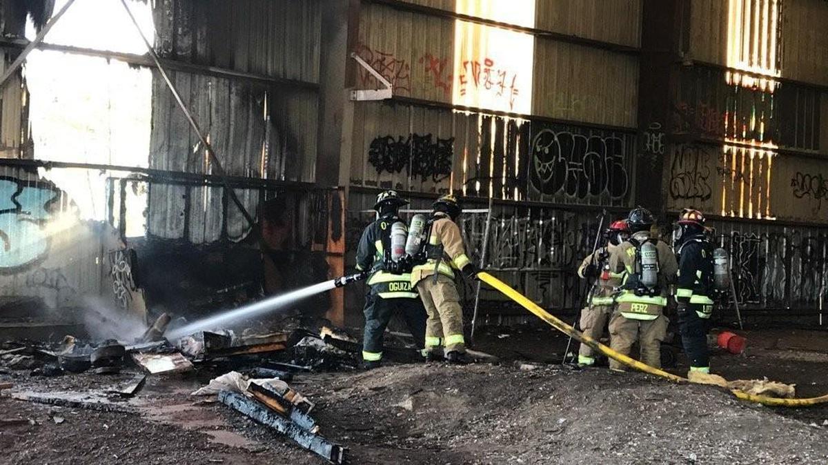 Crews extinguish a small fire at the old Reliable Steel property in Olympia that broke out Monday afternoon.