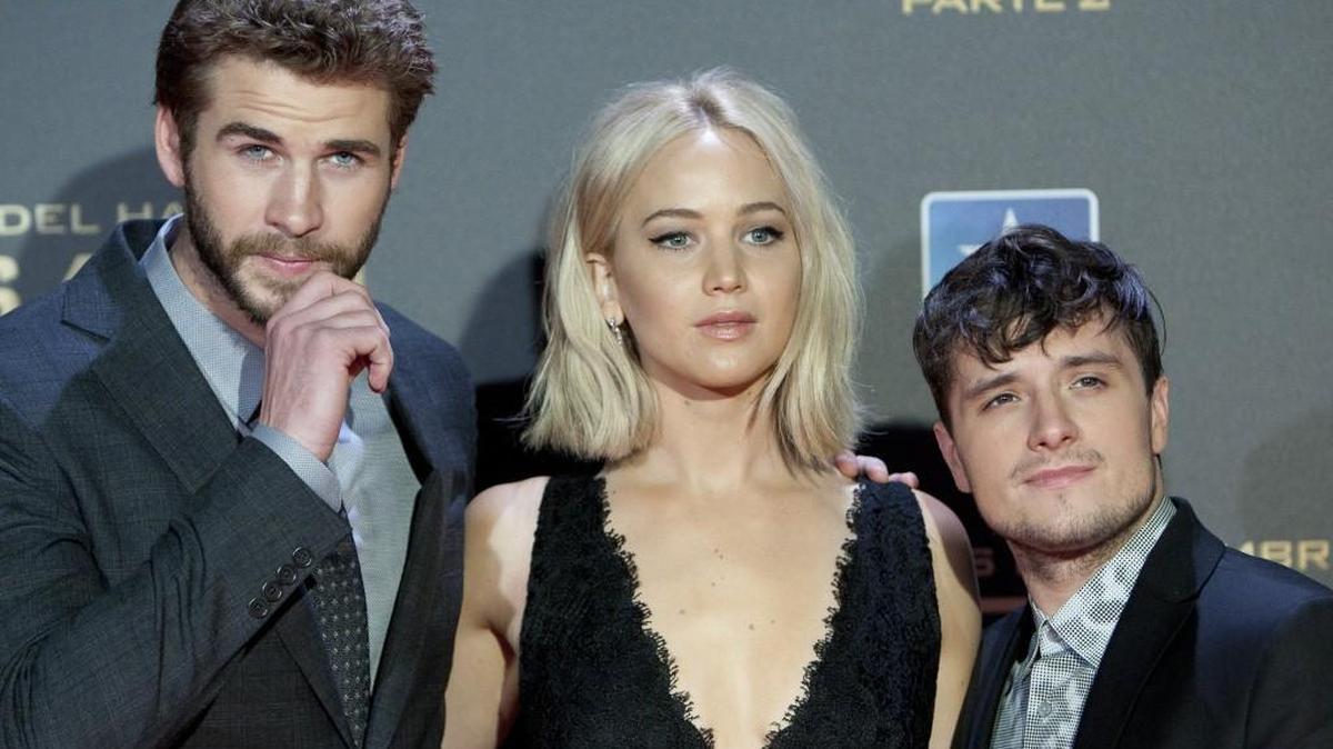 Australian actor Liam Hemsworth, left, and the US actors Jennifer Lawrence, centre, and Josh Hutcherson, right, pose for photographers during the premiere of the film: 'The Hunger Games: Mockingjay Part 2' in Madrid, Spain. Tuesday Nov. 10, 2015.