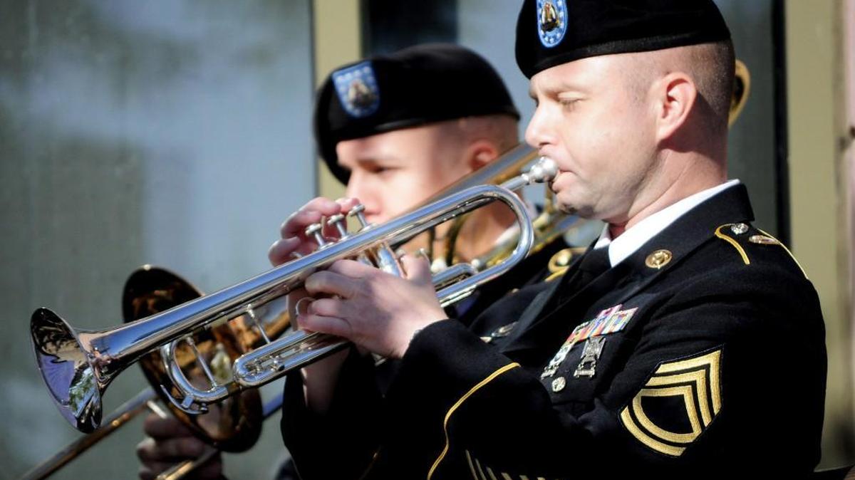 Members of the 56th Army Band's Brass Quintet perform at the 10th Anniversary Celebration of the Puyallup Library. KEVIN KNODELL/Special to the Herald