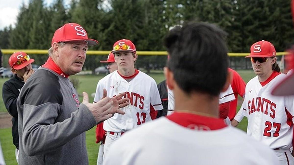 Saint Martin’s University baseball coach Ken Garland (left), who coached the Saints for 10 seasons, died Friday.