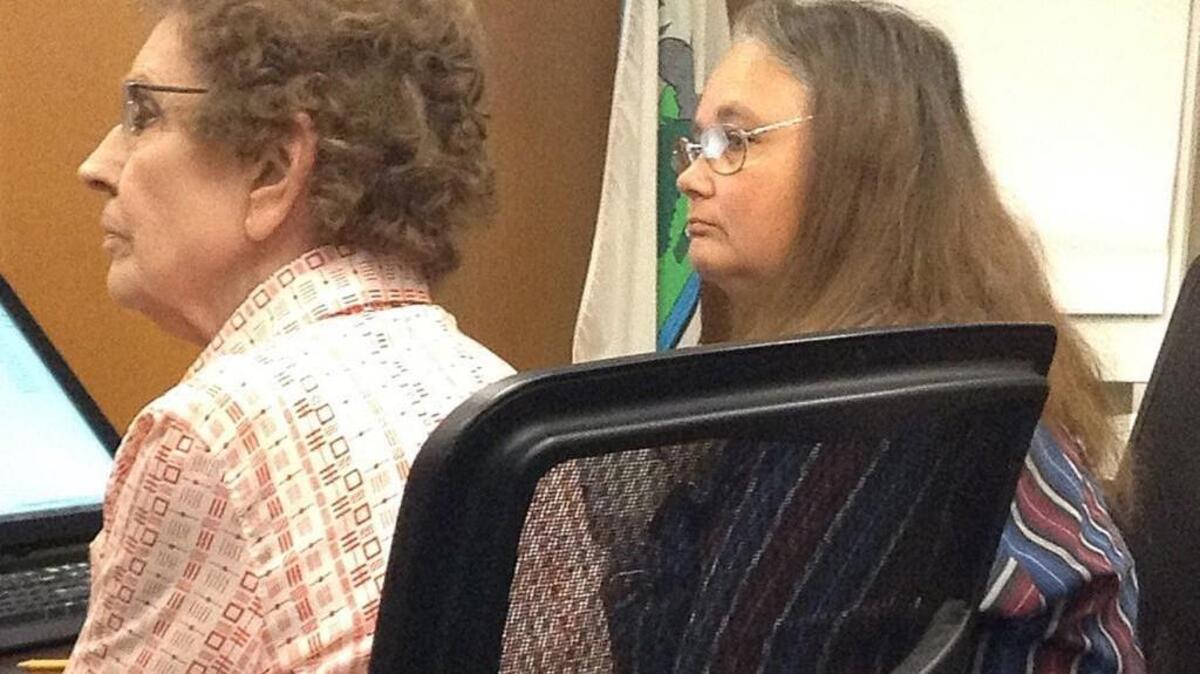Carolyn and Debbie (right) Lattin appear in Thurston County District Court on Monday.