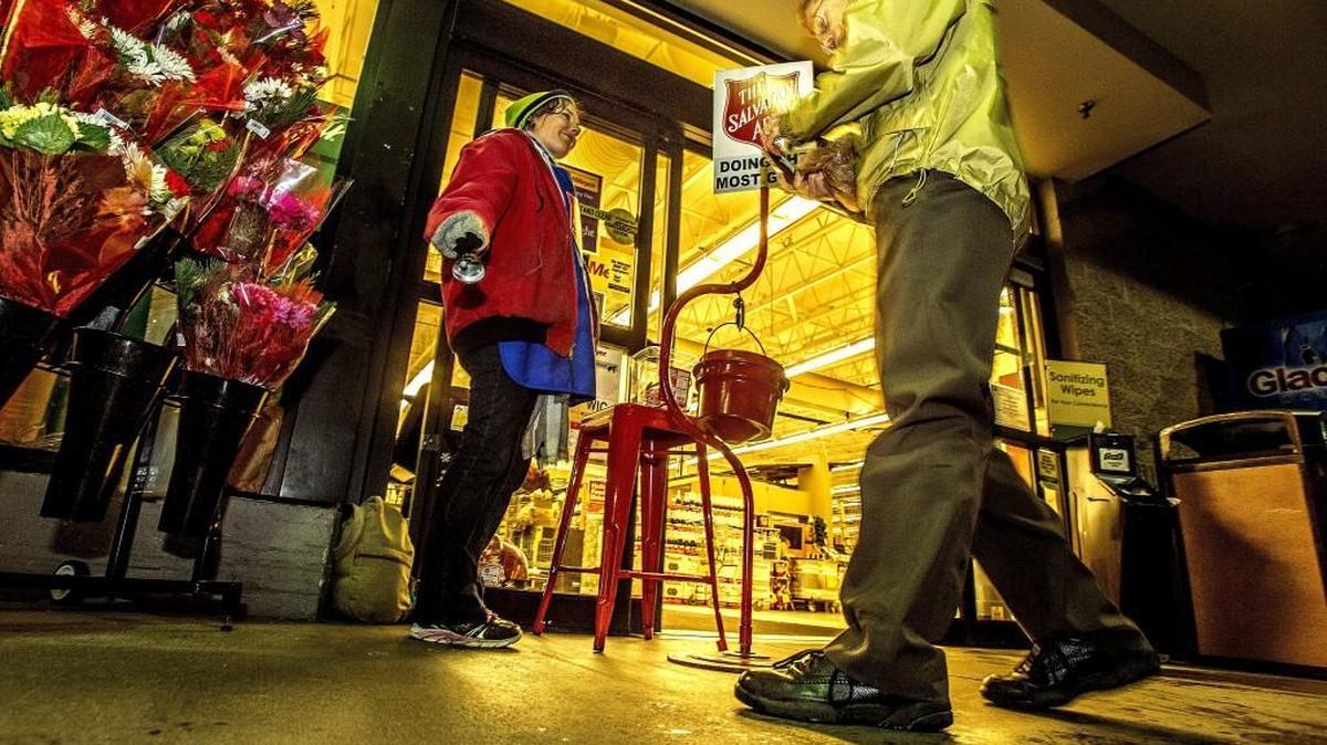 Audrey Frick, of Tacoma, rings a bell outside the Fred Meyer grocery store in Gig Harbor in 2015.