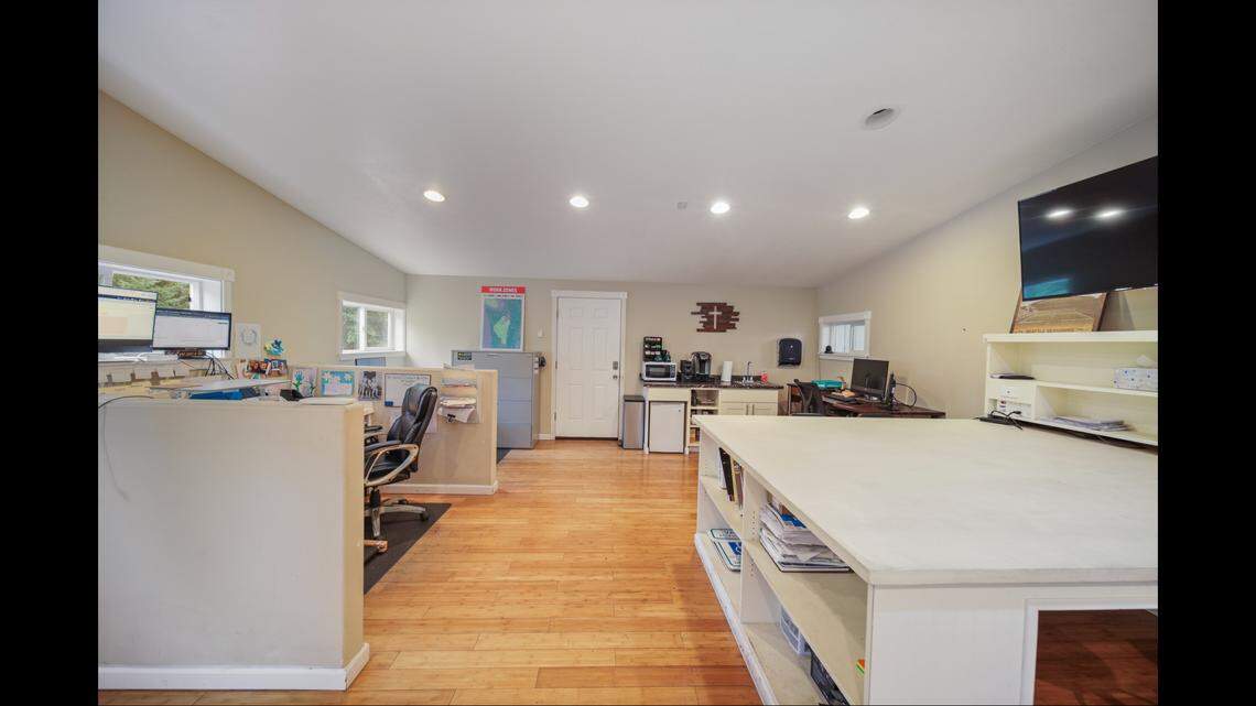 The Olympia home’s shop includes an office.