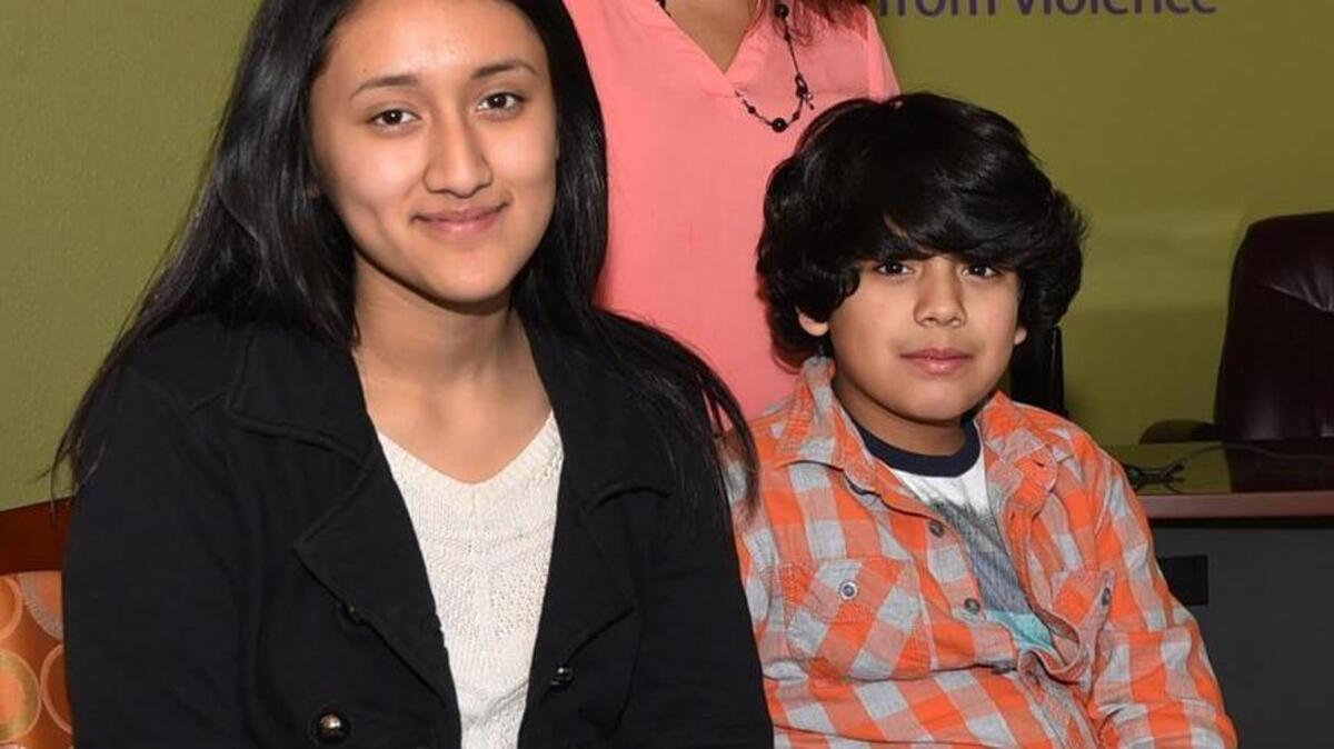 A SafePlace client 10 years ago and now a staff member helping others, Lucy Santiago has a home of her own where she can raise her children, Adela,14, and Andres,10. Photo taken at SafePlace Nov 22, 2015.
