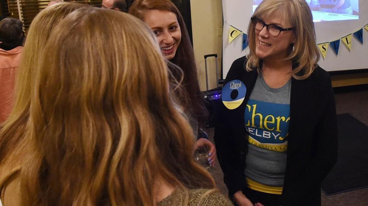 FILE PHOTO: Olympia mayoral candidate Cheryl Selby speaks with high school volunteers from her campaign at the Ramblin Jack's restaurant before election results begin to come in Nov. 3, 2015.