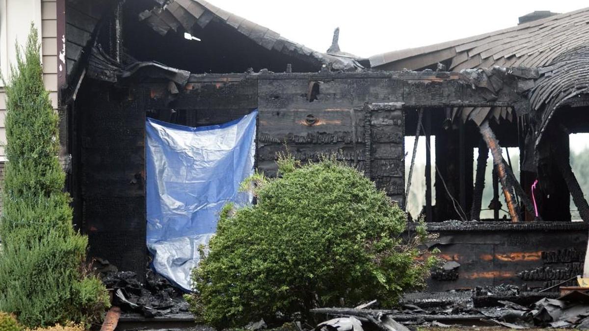 Authorities on Friday said a house fire that killed three children March 4 in Centralia was not intentionally set and that the victims died of asphyxiation. The remains of the home are shown above.