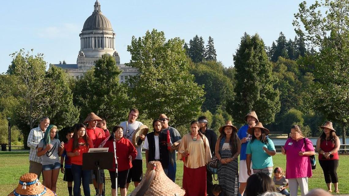 
The Nisqually Canoe Family sings at Olympia’s Heritage Park during the Indigenous Peoples’ Day rally Aug. 17, which focused on the theme of officially changing the national holiday known as Columbus Day to that of Indigenous Peoples Day. Organized by Brian Frisina, the rally featured speakers including Squaxin Tribal Council member Jim Peters and Nisqually council Vice Chair Willie Frank III, and was opened by a song from the Squaxin Island Drum Group.

