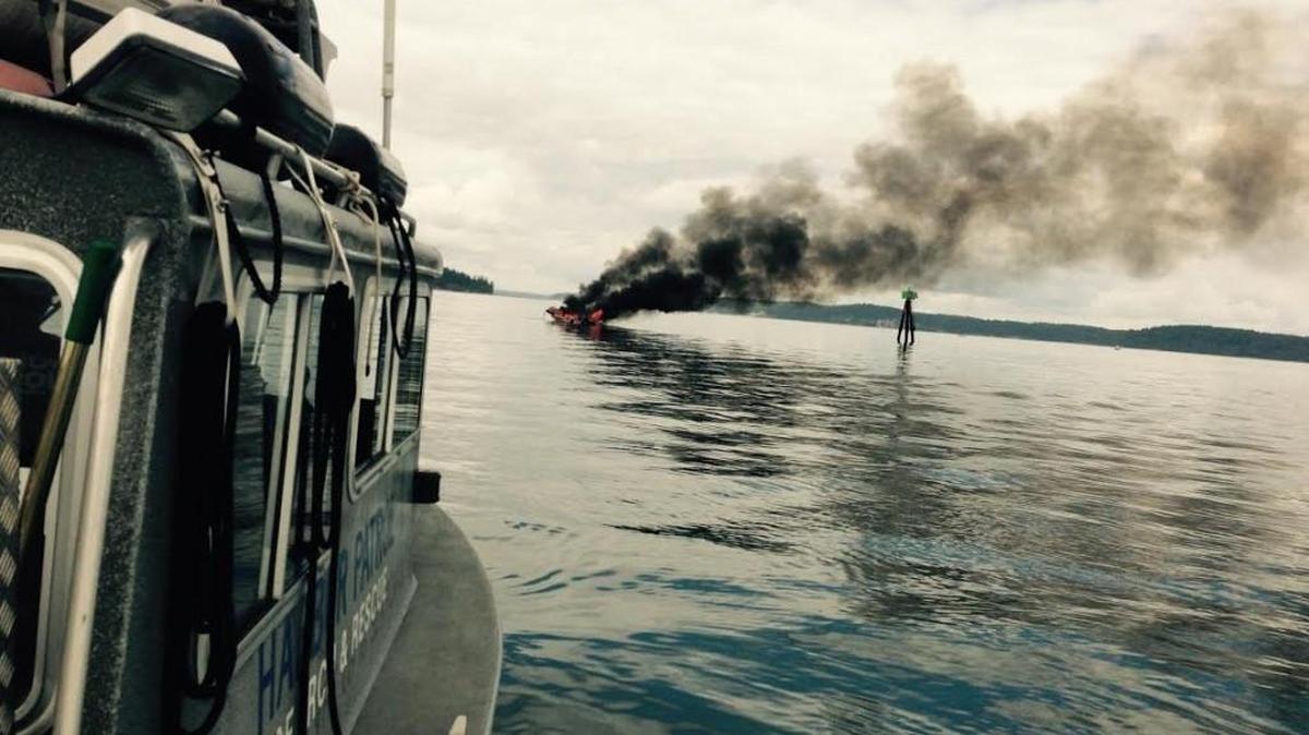 The Port of Olympia harbor patrol, shown here responding to a boat fire in 2016, faces deep cuts to its funding next year if the port commission approves an as is budget with no new tax revenue.