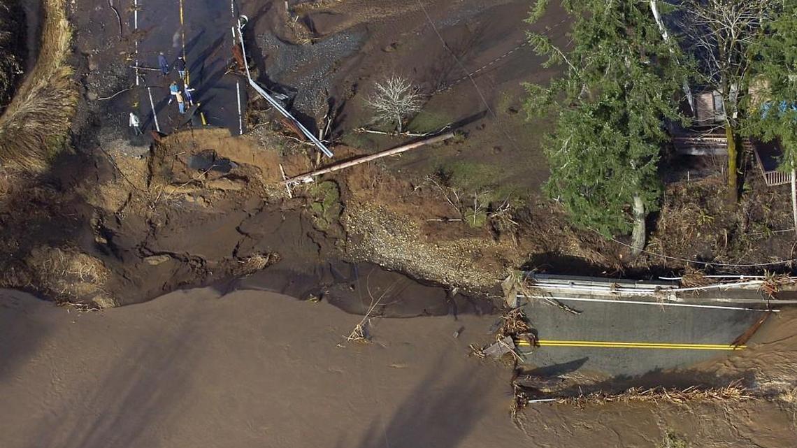 A washed out bridge caused by record floods in rural Lewis County ends up in the Chehalis River on December 4, 2007.