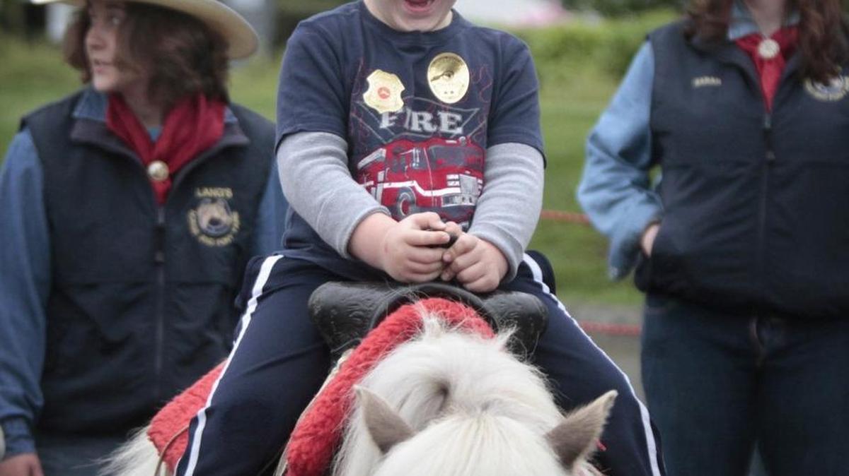 Jesse Connally, 5, of Olympia, enjoys a pony ride during the two-day Lacey Spring Fun Fair on the Saint Martin's University campus on Saturday, May 16, 2015. Pony rides are back by popular demand for 2016.