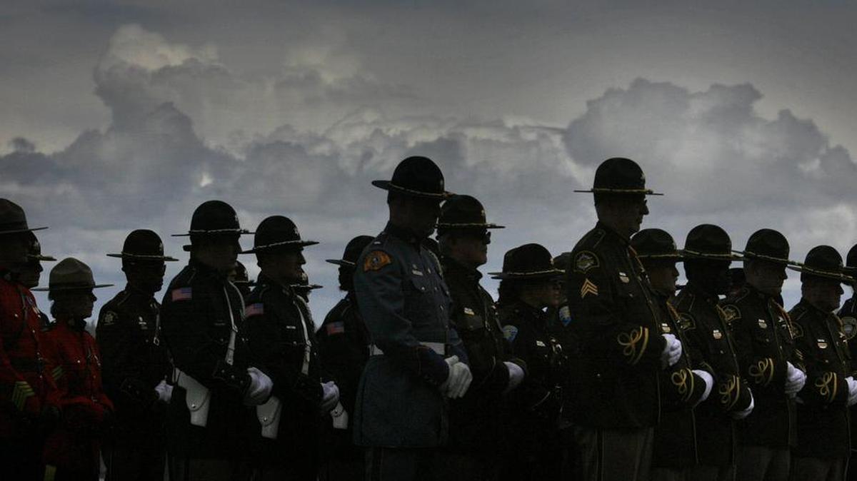 Police officers from around the state and Canada stand during the 2012 Law Enforcement Medal of Honor/Peace Officers Memorial on the Capitol Campus in Olympia.