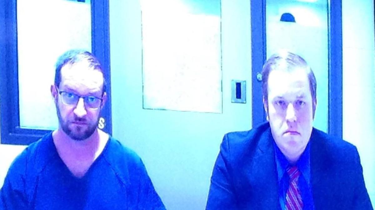 Hunter Scott Christian (left), who is accused of 13 counts of first-degree animal cruelty, appeared in Thurston County Superior Court on Monday. He is shown here next to public defender Luke Swinney.