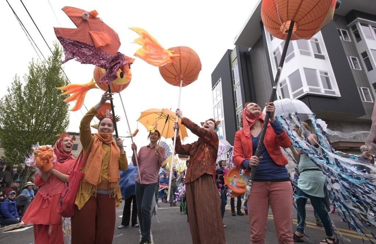 Puffer fish Claribel Gross, from second from left, Jeff Painter, Jesse Morrow and Kira Batcheller battle the wind during the 2017 Procession of the Species.