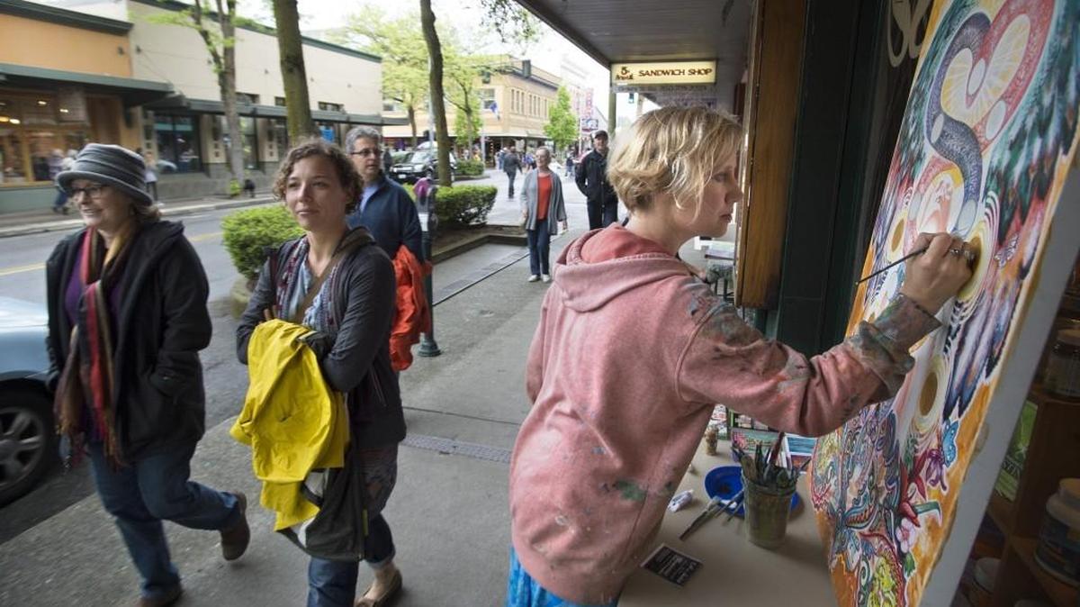 Olympia artist Heather Taylor works on "Emergence," an acrylic painting during Spring ArtsWalk in downtown Olympia in April. The fall ArtsWalk is this weekend.
