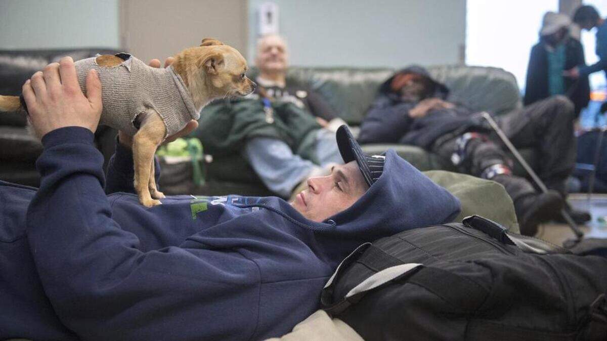 Chad Krizan relaxes at the Providence Community Care Center in downtown Olympia in January. The center was one place volunteers counted people on Jan. 25 for the county's homeless census.