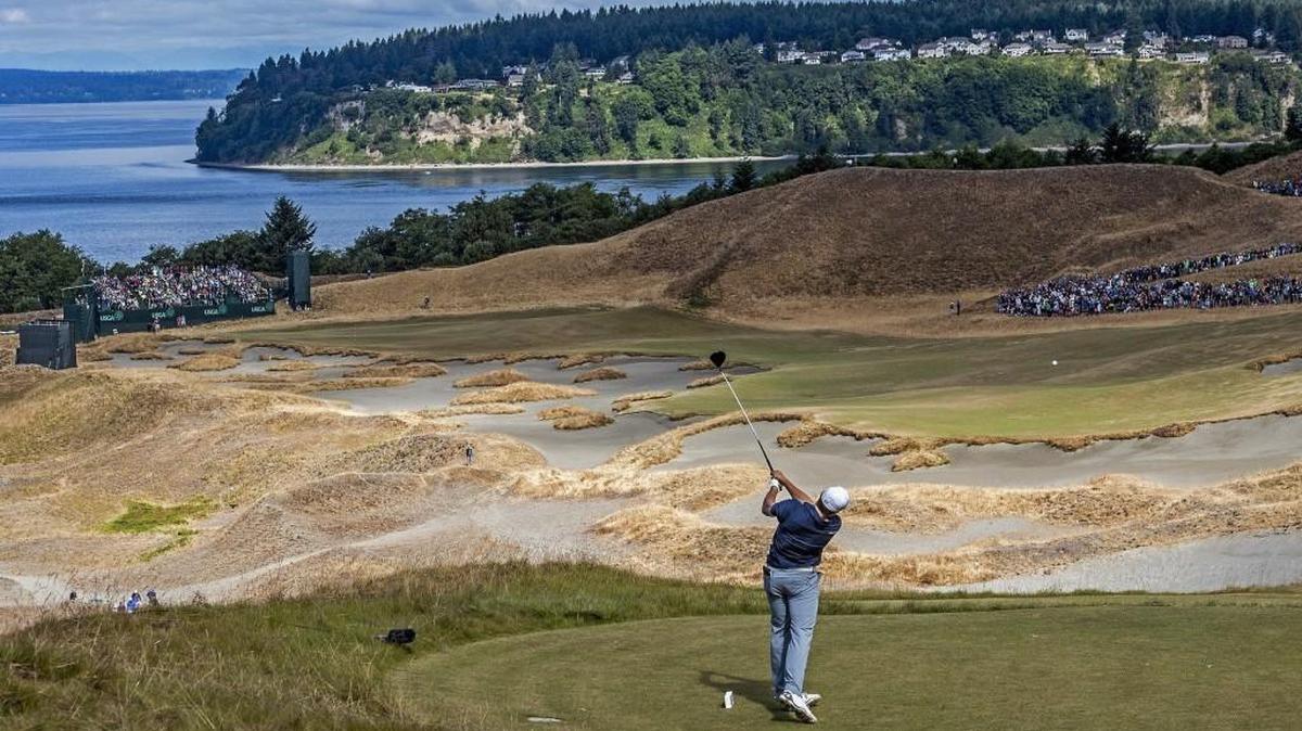 Jordan Spieth tees off with a sweeping view of Fox Island during the U.S. Open at Chambers Bay in June 2015.