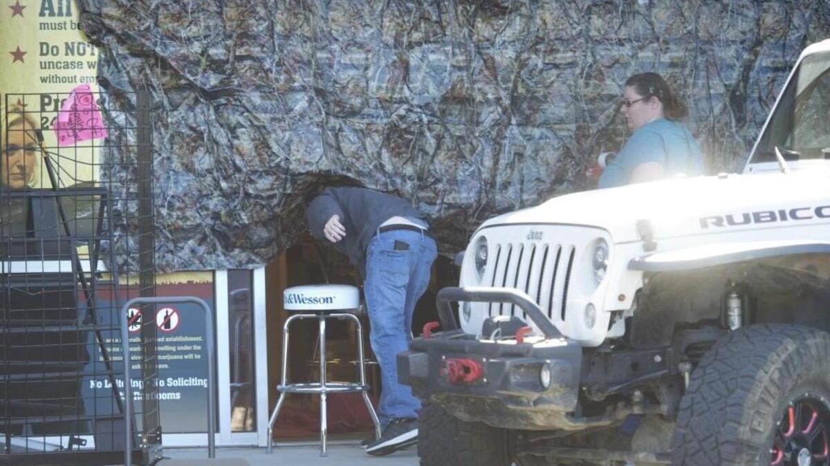 Workers close up the front of I-5 Guns & Ammo on Martin Way after burglars crashed a stolen car through the front of the the store, stealing tens of thousands of dollars worth of guns in less than a minute on Friday, May 26, 2017.