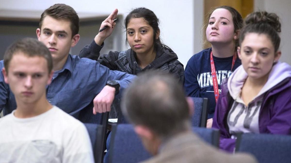 River Ridge High junior Martha Arriaga (hand up), 16, offers her thoughts on preferable qualities in a district leader during the superintendent search meeting with search consultant Mike Boring at the North Thurston Public Schools administration building in Lacey on Wednesday, Jan. 20, 2016.