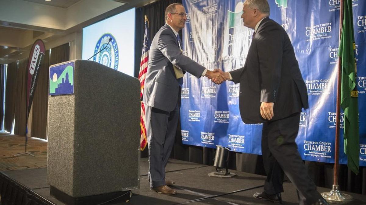 
David Schaffert (left), president and CEO of the Thurston County Chamber of Commerce, greets Thurston County prosecutor Jon Tunheim during the chamber's monthly meeting at the Red Lion Inn in Olympia on Wednesday, Sept. 9, 2015.
