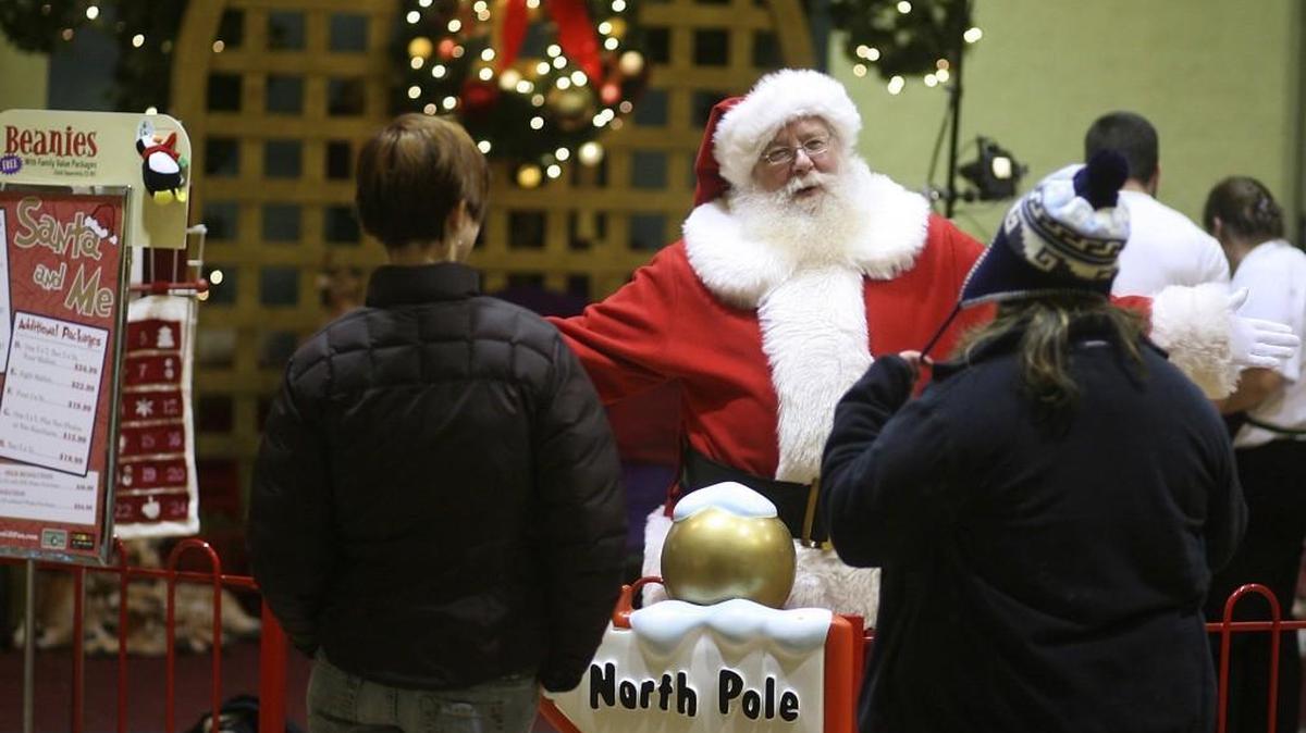 Santa Claus will be at Capital Mall now through Dec. 24. Above, Santa talks with shoppers as they pass by the North Pole at the former Westfield Mall in 2008.