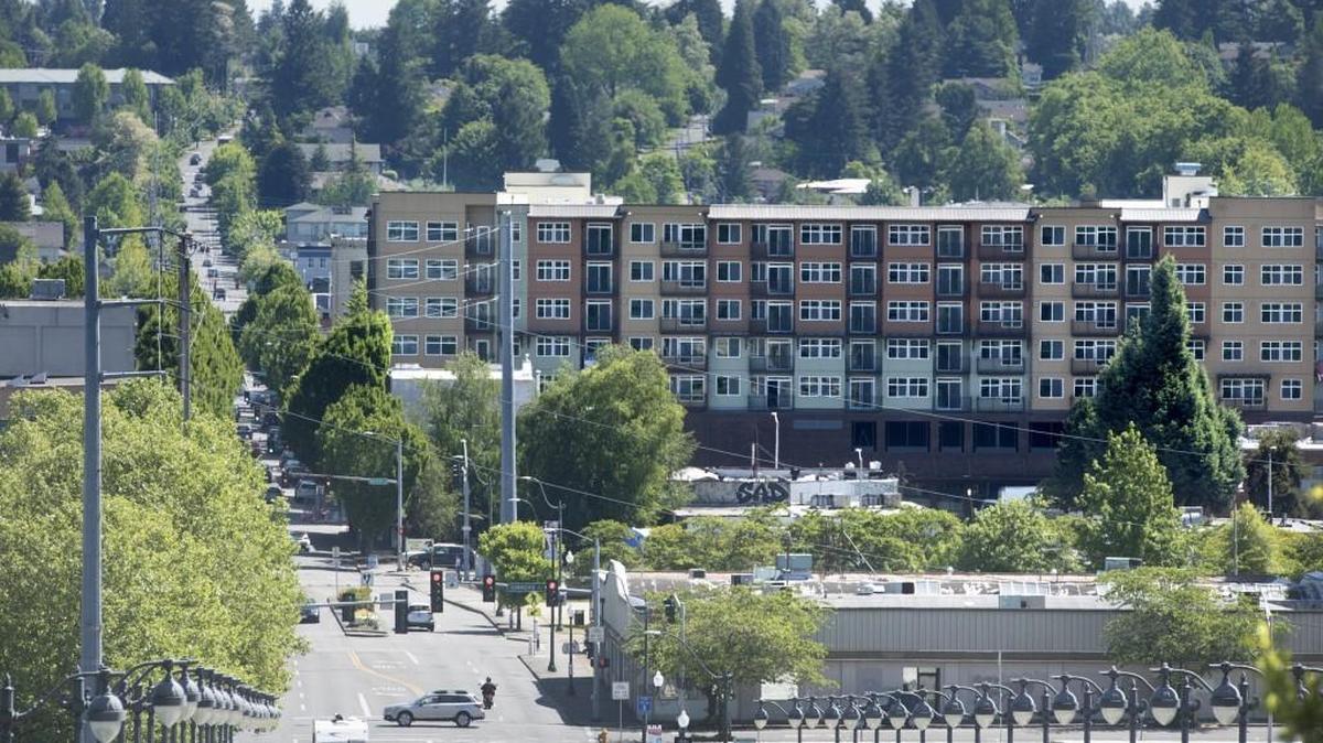 The new 123 4th apartment building rises out of downtown Olympia, shown here looking east on Fourth Avenue on Wednesday, May 11, 2016.