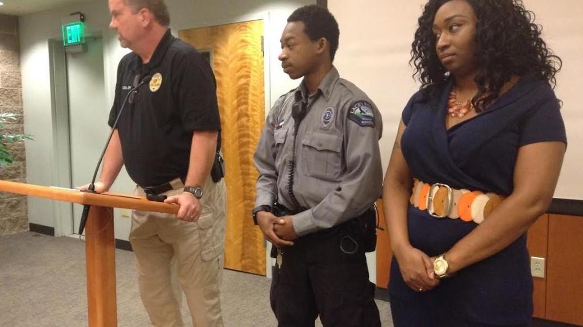 Sgt. Matt Koehler, left, of the Lacey Police Department, introduces Dermonte Gobert and Mary Tilliman to Lacey City Council members Thursday. Gobert and Tilliman were thanked for helping a woman in a parking lot in December.