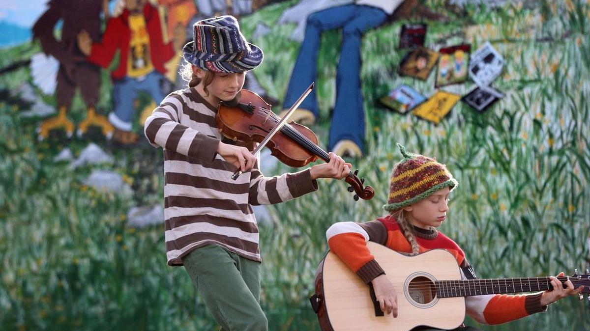 River Scheuerell (left), 12, and Sage Scheurerell, 9, perform during the 2013 Fall Arts Walk in downtown Olympia. This year’s Fall Arts Walk is Friday and Saturday.