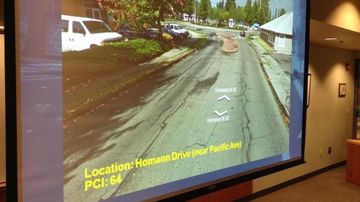 During Thursday’s Lacey City Council work session, Public Works Director Scott Egger showed examples of city streets that would benefit from Transportation Benefit District funding. Homann Drive Southeast has a pavement condition index of 64, which indicates it needs some fixing.