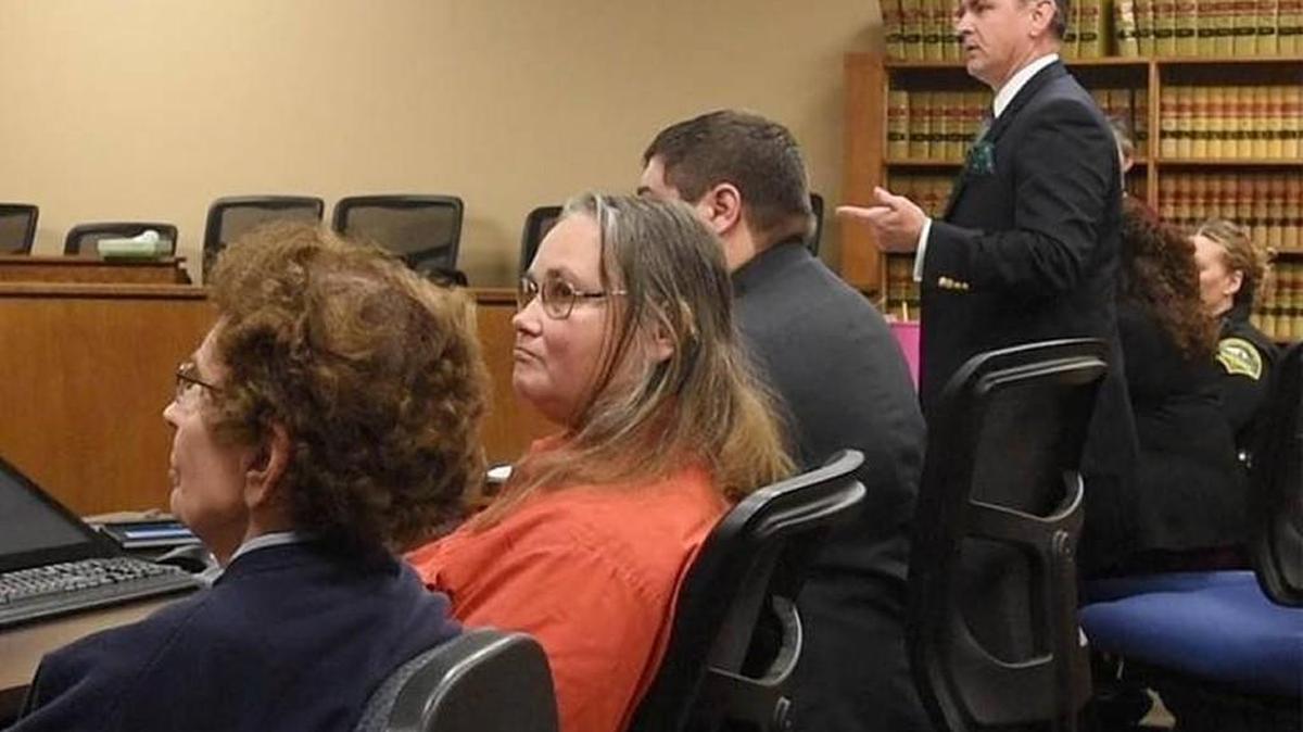 Seated alongside their attorney Justin Kover, Carolyn (left) and Debbie Lattin listen as Chief Criminal Deputy Prosecutor Jeffery Lippert addresses Thurston County District Court Judge Sam Meyer during Tuesday’s sentencing on a second-degree animal cruelty conviction.