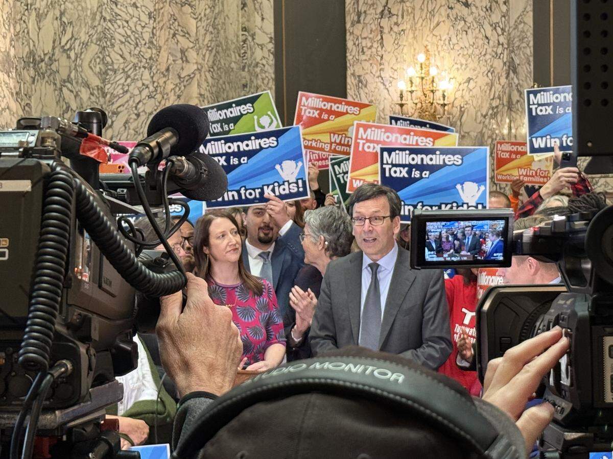 Gov. Bob Ferguson held a news conference on March 30, 2026, at the Legislative Building in Olympia, just before he signed the “millionaires tax” into law.