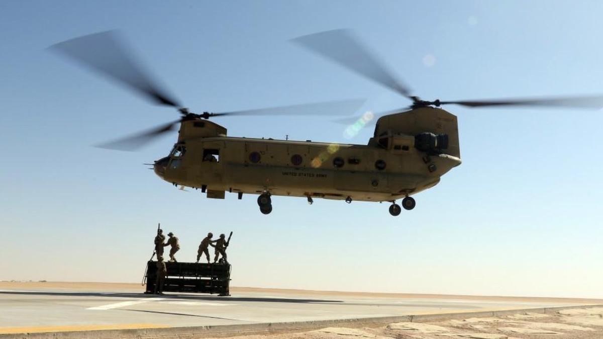 
A Washington National Guard battalion is in its final preparations for a deployment that will take it to Kuwait for much of 2016. Here, a CH-47 Chinook from the Colorado National Guard practices a cargo-lifting technique in Kuwait on Sept. 24.
