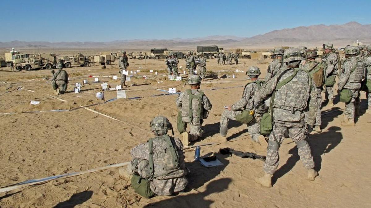 The National Training Center in California provides enough space for the Army to practice extremely large scale operations involving thousands of soldiers who might fight a similarly sized enemy. Here, commanders from the 3rd Brigade, 2nd Infantry Division walk through a battle plan in early 2014.