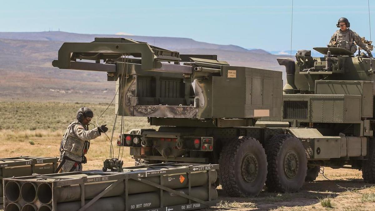 
Solders unload an empty rocket pod during training at Yakima Training Center in April 2014. The troops were about to practice firing a High Mobility Artillery Rocket System.
