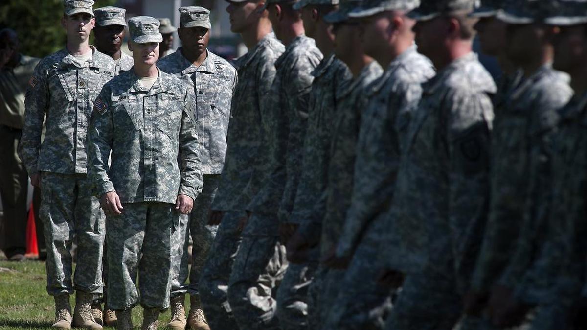 
New 7th ID commander Maj. Gen. Thomas James, middle left, observes the troops as they pass the reviewing stand Tuesday during the 7th Infantry Division Change of Command ceremony on Watkins Field on Joint Base Lewis-McChord.
