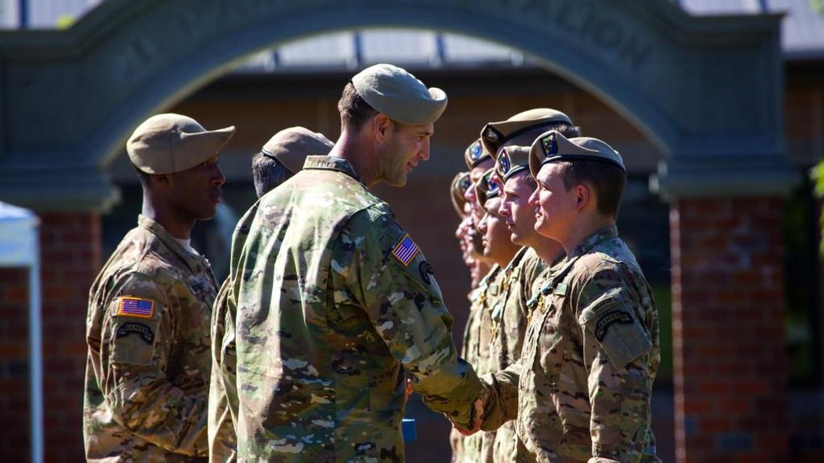 
Lt. Col. Jay Bartholomees, commander, center, presents a Joint Service Commendation Medal to a recipient at Joint Base Lewis-McChord on Friday morning, Sept. 11, 2015 at an awards ceremony for the Second Battalion, 75th Ranger Regiment.
