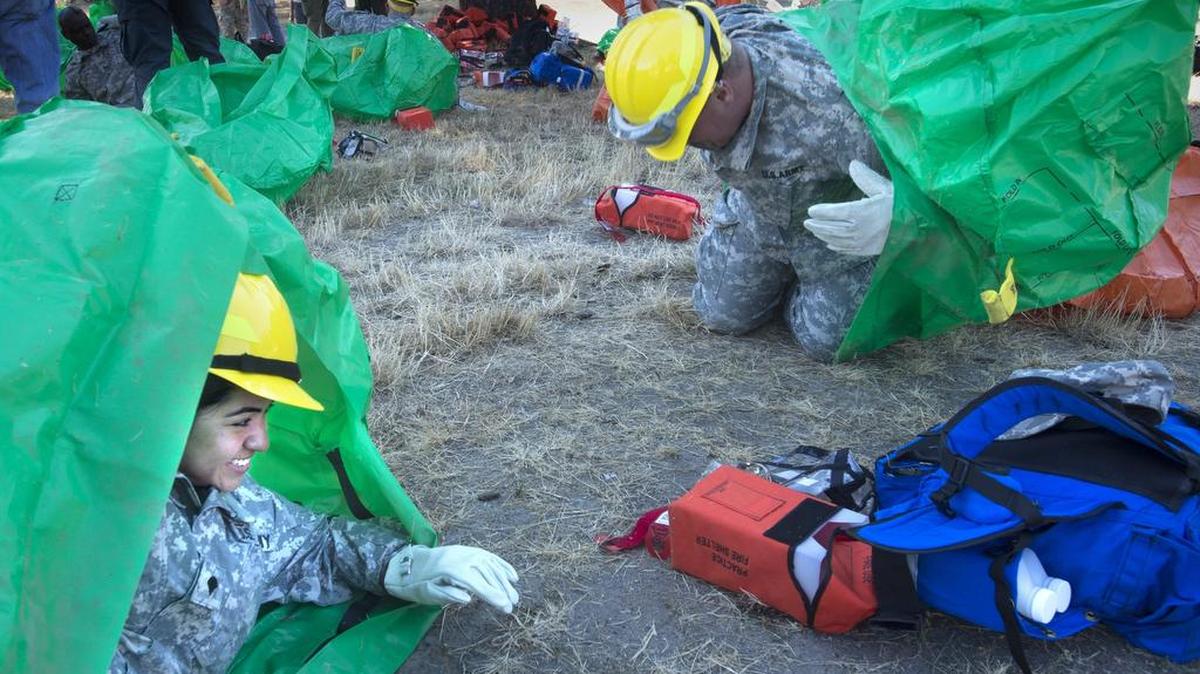 
Army Spc. Marianna Giles looks like she’s enjoying her fire shelter during training from U.S. Forest Service instructors at Joint Base Lewis-McChord on Wednesday, Aug. 19, 2015. Giles is part of the 17th Field Artillery Brigade that will deploy to fight Washington wildfires this week.

