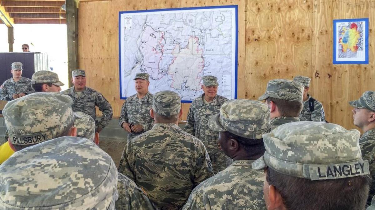 Gen. Frank Grass, chief of the U.S. National Guard Bureau, visited National Guard firefighting camps near Colville on Thursday. More than 2,000 National Guard members have been called up to fight fires in five Western states.