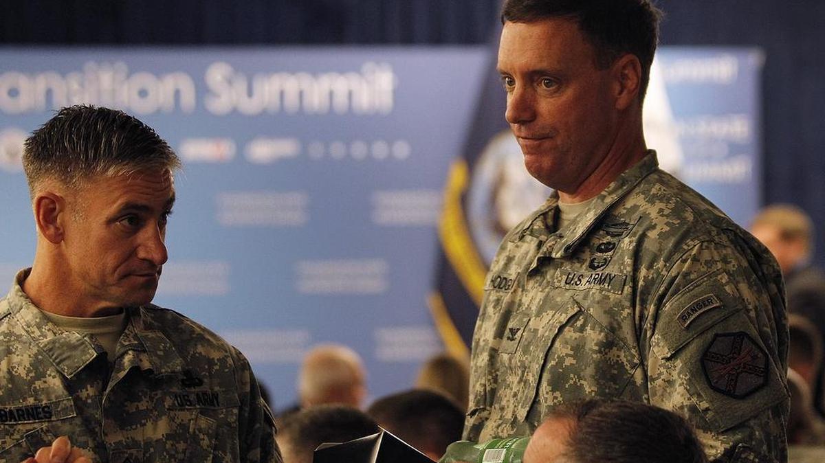 
Base Commander Col. Charles Hodges, right, chats with a group seated at a luncheon table in October before Sen. Patty Murray delivered the keynote address for the Washington State Service Member for Life Transition Summit event held at Joint Base Lewis McChord. 
