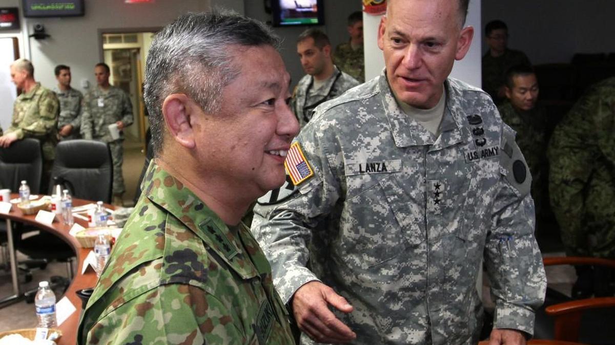 Lt. Gen. Stephen Lanza jokes with Lt. Gen. Junji Suzuki of the Japan Ground Self Defense Force during an October meeting at Joint Base Lewis-McChord. They were preparing for Yama Sakura, a December exercise in Japan that will link their commands. Army photo.