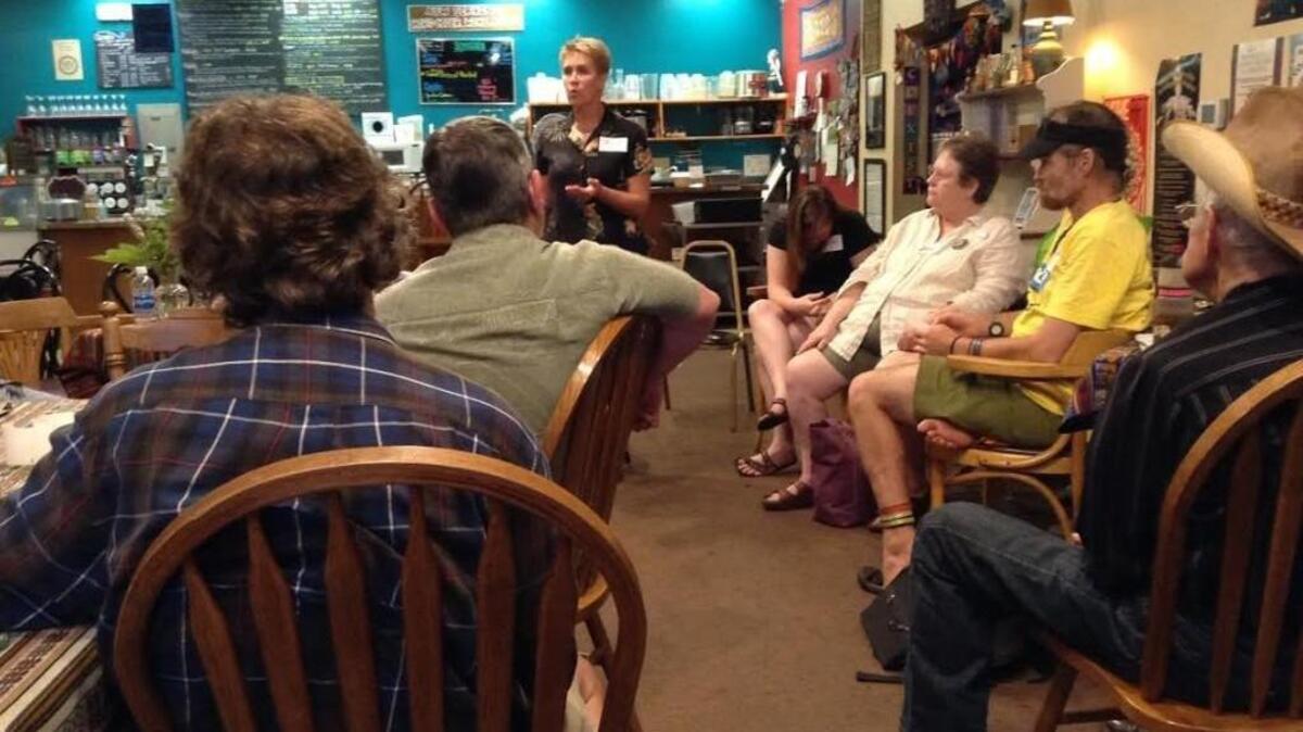 Private citizen E.J. Zita, who also happens to be a Port of Olympia commissioner, addresses the audience during a listening session at Traditions Cafe on Thursday.