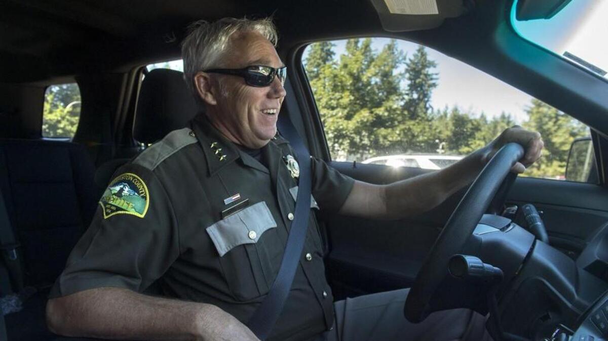 Thurston County Sheriff John Snaza, pictured on his way to a suspect search in 2017, hit a pickup truck in his county-issued vehicle on Pacific Avenue in Lacey in February 2018.