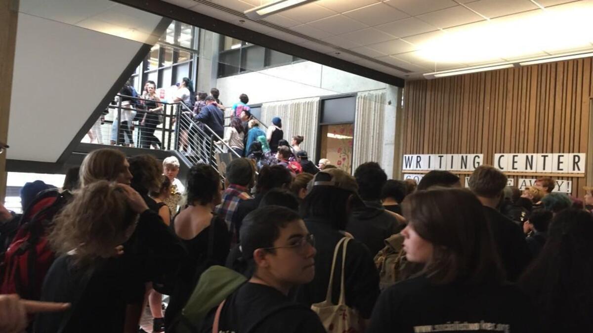 Hundreds of students file into the Library building at The Evergreen State College on May 24, 2017, as part of a protest against the college’s administration.