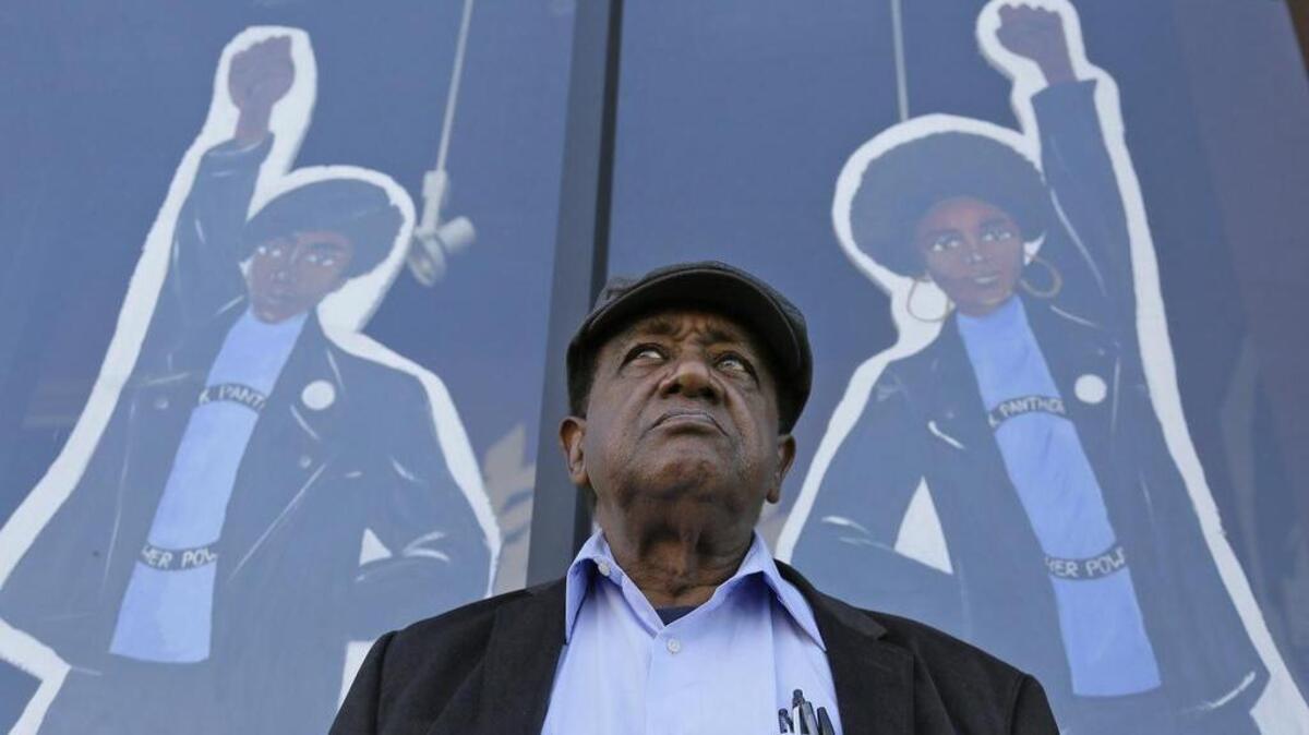 Bobby Seale, who co-founded the Black Panther Party, stands outside the Eastside Arts Alliance and Cultural Center in Oakland, Calif. in 2016. He’ll be in Tacoma this week.