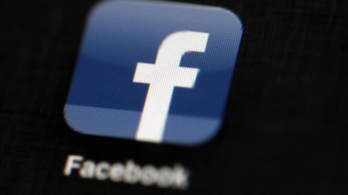 In this May 16, 2012 file photo, the Facebook logo is displayed on an iPad in Philadelphia. Facebook says it’s cracking down on online gun sales, with a new policy that bars private individuals from advertising or selling firearms on the world’s largest social network, Friday, Jan. 29, 2016
