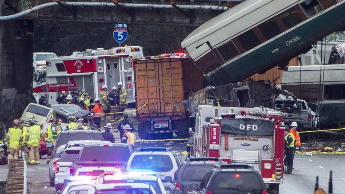 Emergency crews respond to the Amtrak train derailment on a freeway overpass near Dupont on Monday morning.