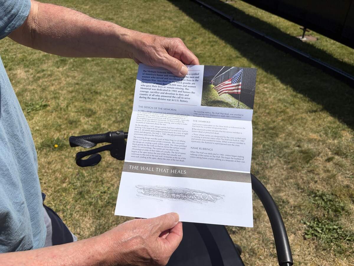 Veteran Charlie Castro shows his charcoal rubbing of a name from The Wall That Heals, a three-quarter scale replica of the Vietnam Veterans Memorial in Washington D.C. The wall arrived in Lacey Wednesday and is open to the public 24/7 through Sunday, June 28.
