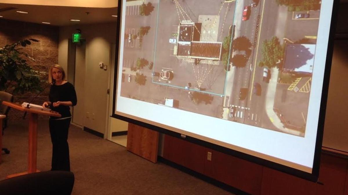 Associate city planner Sarah Schelling discusses the proposed coffee shop/restaurant development on Sleater-Kinney Road Southeast. Lacey City Council approved a conditional use permit for the project on Thursday.