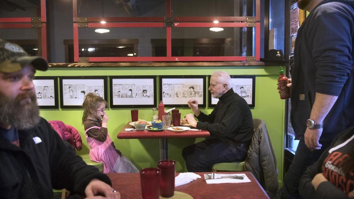 Mort Shecter of Olympia enjoys a Saturday morning breakfast with his granddaughter, Eleanor Rose, 5, at Darby’s Restaurant in the newly-renovated Thurston First building in downtown Olympia.