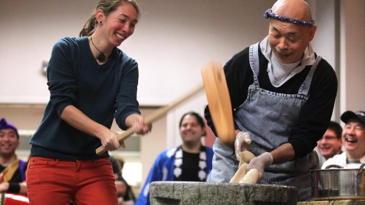 Kristen Matsumura of Olympia swings the wooden mallet as she assists Shoichi Sugiyama of Bellevue in making mochi rice paste during the Japanese New Year celebration at The Olympia Center in 2013. Mochi making will again be part of the Olympia Japanese American Citizens League’s New Year’s celebration Saturday afternoon.